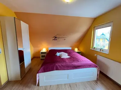 Ein Bett oder Betten in einem Zimmer der Unterkunft Ferienhaus Brise - Austernperle