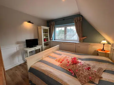 Ein Bett oder Betten in einem Zimmer der Unterkunft Ferienhaus Brise - Ahabs Kajüte