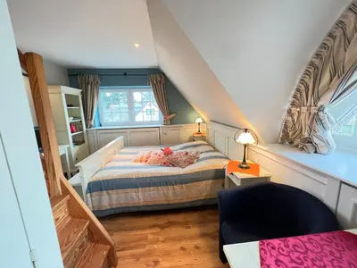 Ein Bett oder Betten in einem Zimmer der Unterkunft Ferienhaus Brise - Ahabs Kajüte