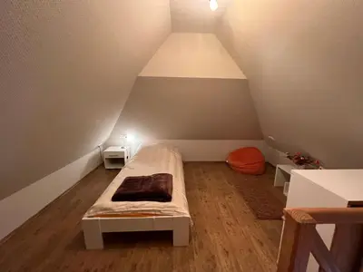 Ein Bett oder Betten in einem Zimmer der Unterkunft Ferienhaus Brise - Ahabs Kajüte