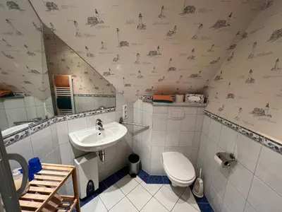 Ein Badezimmer in der Unterkunft Ferienhaus Brise - Skipper's Kabine