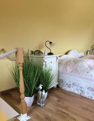 Ein Bett oder Betten in einem Zimmer der Unterkunft Ferienhaus Brise - Schmugglerhus