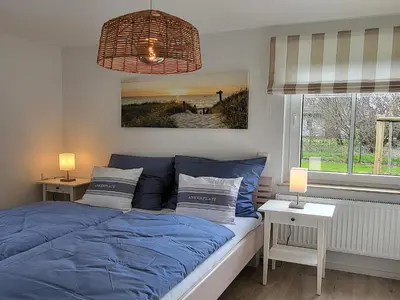 Ein Bett oder Betten in einem Zimmer der Unterkunft Schwedengang 7A Whg 1 unten links
