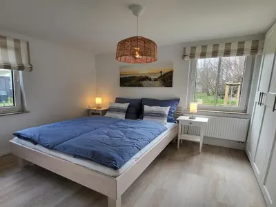 Ein Bett oder Betten in einem Zimmer der Unterkunft Schwedengang 7A Whg 1 unten links