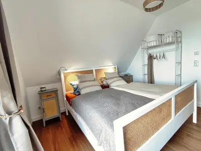 Ein Bett oder Betten in einem Zimmer der Unterkunft Ferienhaus Zur Oie