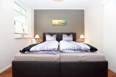 Ein Bett oder Betten in einem Zimmer der Unterkunft FeWo Ferienwelle