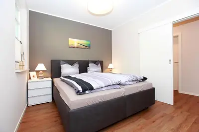 Ein Bett oder Betten in einem Zimmer der Unterkunft FeWo Ferienwelle