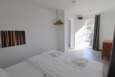 Ein Bett oder Betten in einem Zimmer der Unterkunft Bungalow Schifferberg Lodge