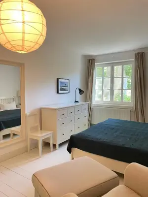 Ein Bett oder Betten in einem Zimmer der Unterkunft Fe-Wo Schifferberg Lodge