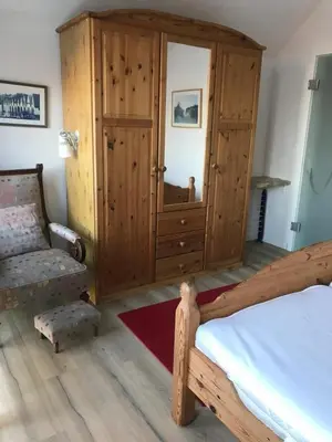 Ein Bett oder Betten in einem Zimmer der Unterkunft Min Lütt