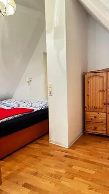 Ein Bett oder Betten in einem Zimmer der Unterkunft Unterm Rohrdach