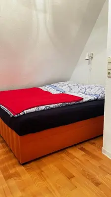 Ein Bett oder Betten in einem Zimmer der Unterkunft Unterm Rohrdach