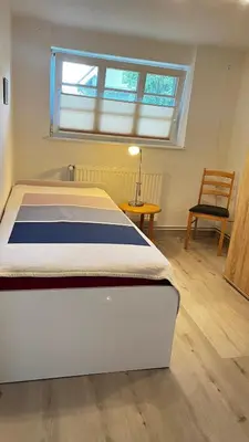 Ein Bett oder Betten in einem Zimmer der Unterkunft Unterm Rohrdach
