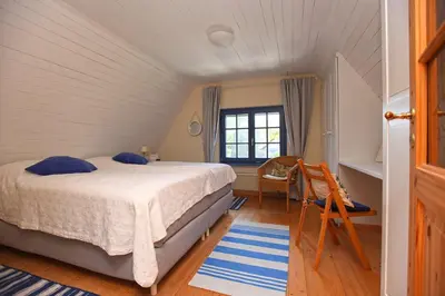 Ein Bett oder Betten in einem Zimmer der Unterkunft Ferienhaus Strandrose