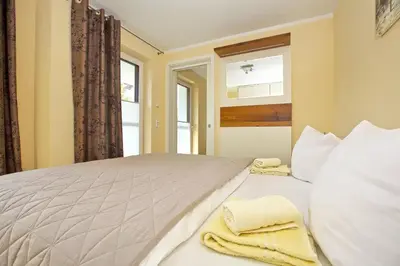 Ein Bett oder Betten in einem Zimmer der Unterkunft Ostseetraum 03 - Aquamarin
