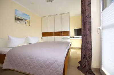Ein Bett oder Betten in einem Zimmer der Unterkunft Ostseetraum 03 - Aquamarin