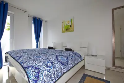Ein Bett oder Betten in einem Zimmer der Unterkunft Ostseetraum 04 - Aquamarin
