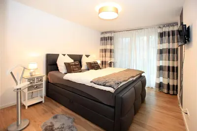 Ein Bett oder Betten in einem Zimmer der Unterkunft Ferienwohnung Bickbeeren C2