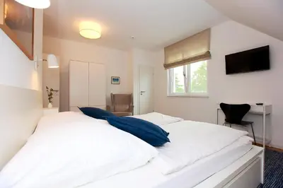 Ein Bett oder Betten in einem Zimmer der Unterkunft FeWo Bark Middenmang
