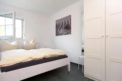 Ein Bett oder Betten in einem Zimmer der Unterkunft Haus Sanddorn Hooghass FW3