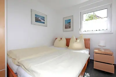 Ein Bett oder Betten in einem Zimmer der Unterkunft Haus Sanddorn Hooghass FW4