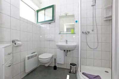 Ein Badezimmer in der Unterkunft Haus Sanddorn Hooghass FW4