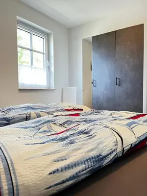 Ein Bett oder Betten in einem Zimmer der Unterkunft Lotte's lütte Stuv