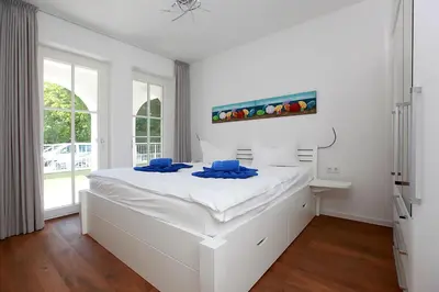 Ein Bett oder Betten in einem Zimmer der Unterkunft Kleine Seebären