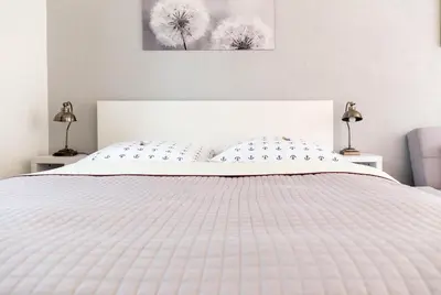 Ein Bett oder Betten in einem Zimmer der Unterkunft Sonnenblumenhaus 01