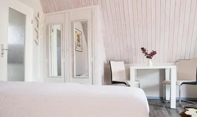 Ein Bett oder Betten in einem Zimmer der Unterkunft Sonnenblumenhaus 02