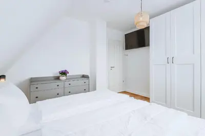 Ein Bett oder Betten in einem Zimmer der Unterkunft Zur Oie 27b
