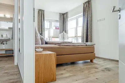 Ein Bett oder Betten in einem Zimmer der Unterkunft Haus Strandidyll - Suite Strandmuschel
