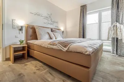 Ein Bett oder Betten in einem Zimmer der Unterkunft Haus Seestern - Suite Seeluft