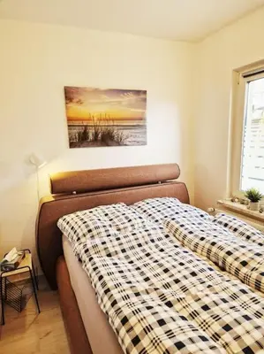 Ein Bett oder Betten in einem Zimmer der Unterkunft Ferienhaus Kranichnest