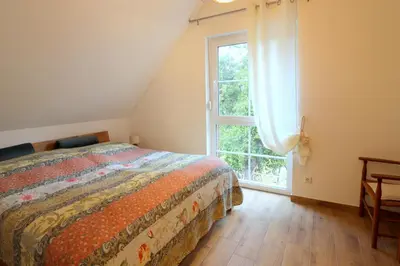 Ein Bett oder Betten in einem Zimmer der Unterkunft Fischlandhus 2 mein Lieblingsplatz