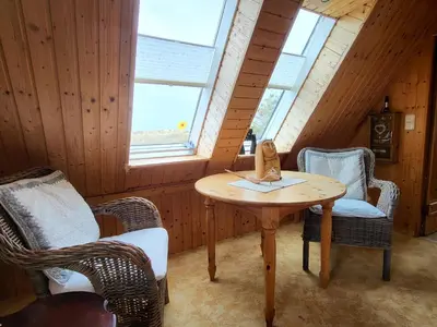 Ein Sitzbereich in der Unterkunft Ferienhaus Dünenhaus