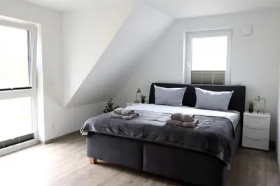 Ein Bett oder Betten in einem Zimmer der Unterkunft Boddenblick 9 a