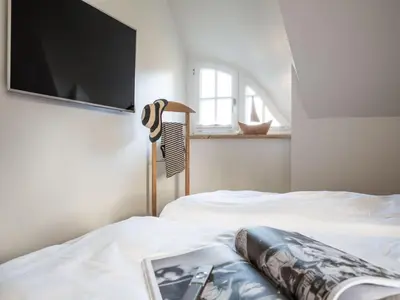 Ein Bett oder Betten in einem Zimmer der Unterkunft Reetdachhaus in Fuhlendorf mit Sauna nahe Bodden