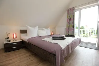 Ein Bett oder Betten in einem Zimmer der Unterkunft Ferienhäuser Ferienhaus Boddenperle