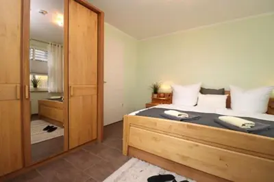 Ein Bett oder Betten in einem Zimmer der Unterkunft Residenz am Hafen Boddensuite