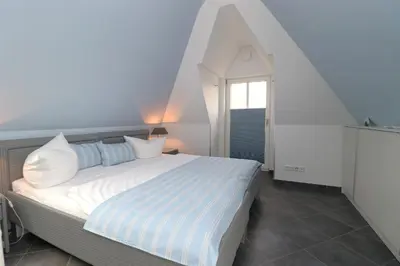 Ein Bett oder Betten in einem Zimmer der Unterkunft Residenz am Hafen Neptunsuite