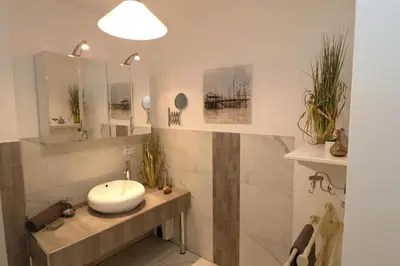 Ein Badezimmer in der Unterkunft Residenz am Hafen Suite Boddenkieker