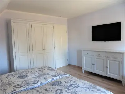 Ein Bett oder Betten in einem Zimmer der Unterkunft Strandsuite