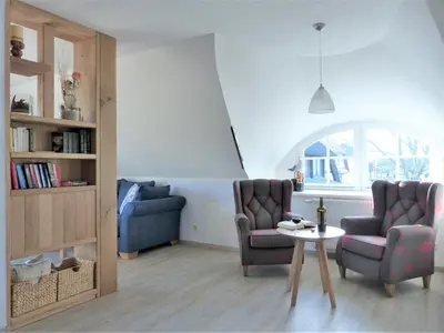 Ein Sitzbereich in der Unterkunft Strandsuite