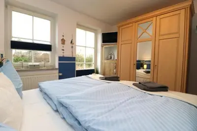 Ein Bett oder Betten in einem Zimmer der Unterkunft Birkenhof App 03