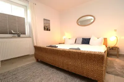 Ein Bett oder Betten in einem Zimmer der Unterkunft Birkenhof App 04, Ostseetraum