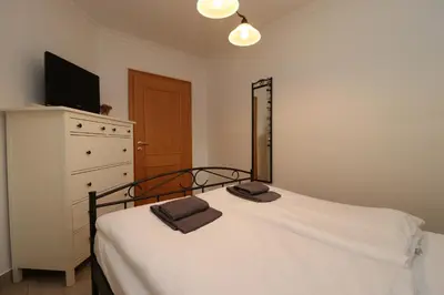 Ein Bett oder Betten in einem Zimmer der Unterkunft Birkenhof App 04, Ostseetraum