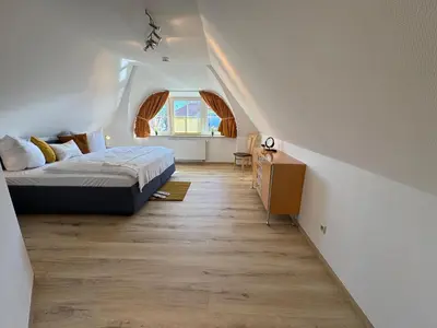 Ein Bett oder Betten in einem Zimmer der Unterkunft Birkenhof App 09, Schmugglerblick