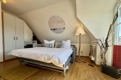 Ein Bett oder Betten in einem Zimmer der Unterkunft Birkenhof App 10, Schatzkammer