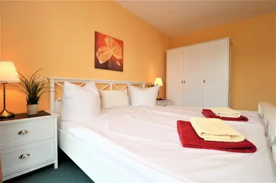 Ein Bett oder Betten in einem Zimmer der Unterkunft Birkenhof App 12